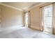 Bright and spacious bedroom with carpet floors, neutral walls, and large windows at 308 Rusty Gate Pass, Woodstock, GA 30189