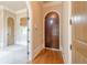 Grand entryway with wood floors, archways, and a striking arched front door at 308 Rusty Gate Pass, Woodstock, GA 30189