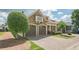 Charming home featuring a brick driveway, two-car garage, and well-maintained front yard at 308 Rusty Gate Pass, Woodstock, GA 30189