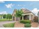 Charming home featuring a brick driveway, two-car garage, and well-maintained front yard at 308 Rusty Gate Pass, Woodstock, GA 30189
