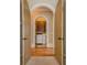 Arched hallway leading to laundry room at 308 Rusty Gate Pass, Woodstock, GA 30189