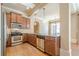 Charming kitchen with stainless steel appliances, granite countertops, and wood cabinets at 308 Rusty Gate Pass, Woodstock, GA 30189