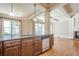 Kitchen with granite countertops and stainless steel appliances opens to the living room at 308 Rusty Gate Pass, Woodstock, GA 30189