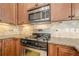 Close up of gas cooktop and stainless steel microwave at 308 Rusty Gate Pass, Woodstock, GA 30189