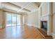 Bright living room featuring a fireplace, hardwood floors, and sliding glass doors to the outside patio at 308 Rusty Gate Pass, Woodstock, GA 30189
