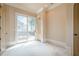 Bright living space featuring neutral walls, neutral carpet, and sliding glass doors to the outdoor patio at 308 Rusty Gate Pass, Woodstock, GA 30189