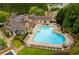 Aerial view of a large community pool with lounge chairs and a beautifully landscaped surround at 308 Rusty Gate Pass, Woodstock, GA 30189
