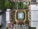 Aerial view showcasing a community pool and garden with walking paths and manicured landscaping at 3376 Peachtree Rd # 1, Atlanta, GA 30326