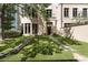 Beautiful backyard with lush green grass, stone pavers, and flower pots adding charm to the property at 3376 Peachtree Rd # 1, Atlanta, GA 30326