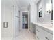 Bright bathroom featuring honeycomb tile, glass shower and quartz countertops at 3376 Peachtree Rd # 1, Atlanta, GA 30326