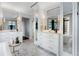 Bright bathroom featuring a large tub, natural lighting, marble countertops, and unique hexagon tile at 3376 Peachtree Rd # 1, Atlanta, GA 30326