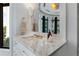 Bathroom vanity featuring marble countertops, a sleek sink and black trim windows overlooking a bright view at 3376 Peachtree Rd # 1, Atlanta, GA 30326