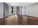 Spacious bedroom with hardwood floors, curved window nook, and neutral decor at 3376 Peachtree Rd # 1, Atlanta, GA 30326