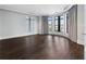 Spacious bedroom with hardwood floors, curved window nook, and neutral decor at 3376 Peachtree Rd # 1, Atlanta, GA 30326