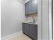 Butler's pantry featuring gray cabinets and quartz countertop at 3376 Peachtree Rd # 1, Atlanta, GA 30326