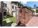 Charming courtyard entrance with brick pathway, bronze tiled wall and landscaped greenery at 3376 Peachtree Rd # 1, Atlanta, GA 30326
