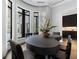 Bright dining room with hardwood floors, modern lighting, and a large round table at 3376 Peachtree Rd # 1, Atlanta, GA 30326