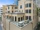Exterior of a multi-story home featuring a large outdoor terrace with an outdoor kitchen at 3376 Peachtree Rd # 1, Atlanta, GA 30326
