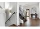Bright foyer with hardwood floors, stairs, and a view to the outside at 3376 Peachtree Rd # 1, Atlanta, GA 30326