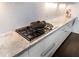 Kitchen featuring marble countertops, stainless steel hardware, and gas cooktop at 3376 Peachtree Rd # 1, Atlanta, GA 30326