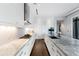Contemporary kitchen with white cabinetry, modern appliances, and marble countertops at 3376 Peachtree Rd # 1, Atlanta, GA 30326