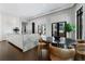Open kitchen with marble island, dining area, stainless steel appliances, and dark hardwood floors at 3376 Peachtree Rd # 1, Atlanta, GA 30326
