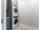 Laundry room with stacked washer and dryer at 3376 Peachtree Rd # 1, Atlanta, GA 30326