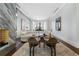 Spacious living room featuring a marble fireplace, curved sofa, and floor-to-ceiling windows at 3376 Peachtree Rd # 1, Atlanta, GA 30326