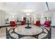 Elegant lobby with a circular marble floor, red chairs, and a decorative chandelier, offering a luxurious entrance at 3376 Peachtree Rd # 1, Atlanta, GA 30326