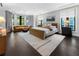 Spacious main bedroom with hardwood floors and a sitting area near bay window at 3376 Peachtree Rd # 1, Atlanta, GA 30326
