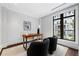 Bright office space with large window, modern desk, and comfortable chairs, perfect for a home workspace at 3376 Peachtree Rd # 1, Atlanta, GA 30326