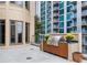 View of a stainless steel outdoor kitchen with flowers on a spacious outdoor terrace with city views at 3376 Peachtree Rd # 1, Atlanta, GA 30326