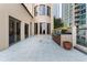 Spacious outdoor terrace featuring an outdoor kitchen, flowers, and beautiful city views at 3376 Peachtree Rd # 1, Atlanta, GA 30326