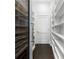 Walk-in pantry featuring a wine cooler and ample shelving for storage at 3376 Peachtree Rd # 1, Atlanta, GA 30326