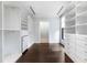 Custom walk-in closet with built-in shelving and drawers at 3376 Peachtree Rd # 1, Atlanta, GA 30326