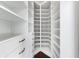 Walk-in closet with hardwood floors, custom shelving, and ample storage space at 3376 Peachtree Rd # 1, Atlanta, GA 30326