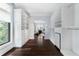 Spacious walk-in closet featuring hardwood floors, custom shelving, and bright window views at 3376 Peachtree Rd # 1, Atlanta, GA 30326
