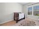 Bedroom with crib and soft rug at 4440 Atwood Dr, Cumming, GA 30040
