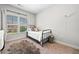 Cozy bedroom with natural light, a twin bed and hardwood floors at 4440 Atwood Dr, Cumming, GA 30040