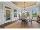 Dining area featuring a wood ceiling, multiple windows, and access to the outdoor patio at 4440 Atwood Dr, Cumming, GA 30040