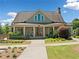 The clubhouse boasts a craftsman exterior with a charming entrance, well-manicured landscaping, and ample natural light at 4440 Atwood Dr, Cumming, GA 30040