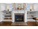 Elegant fireplace with decorative mantle and built-in shelving at 4440 Atwood Dr, Cumming, GA 30040
