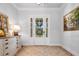 Bright foyer with white door, sidelights, decorative rug, and view to front yard at 4440 Atwood Dr, Cumming, GA 30040