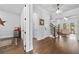 Open hallway with hardwood floors, detailed trim, views to living room and staircase at 4440 Atwood Dr, Cumming, GA 30040