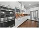 The kitchen offers stainless appliances, custom cabinetry, and granite counters at 4440 Atwood Dr, Cumming, GA 30040