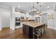 Stylish kitchen featuring a central island with seating, pendant lights, and stainless appliances at 4440 Atwood Dr, Cumming, GA 30040