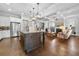 Gourmet kitchen with an island, stainless steel appliances, and direct view into the living room at 4440 Atwood Dr, Cumming, GA 30040
