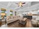 Open concept living space featuring a modern kitchen and sun-filled living area at 4440 Atwood Dr, Cumming, GA 30040