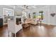 Bright living room with fireplace, coffered ceiling, hardwood floors, and many windows at 4440 Atwood Dr, Cumming, GA 30040