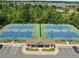An aerial view of community tennis courts, featuring well-maintained courts, a central building, and accessible parking at 4440 Atwood Dr, Cumming, GA 30040